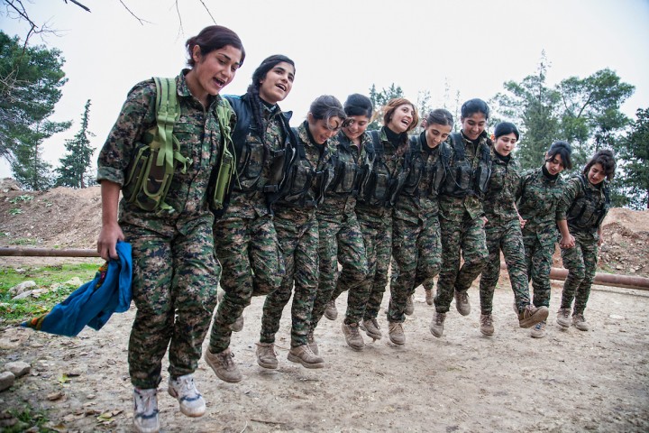 Young girls from the YPJ (Kurdish Female Militia in Syria) dance the traditional Kurdish Dilan during their free time. Derik/Al-Malikiyah, Syria.